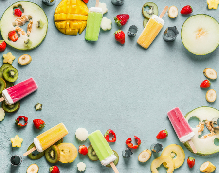 Summer food background with various colorful ice cream, fresh fruits and berries, top view, frameの写真素材