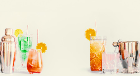 Summer long drinks and cocktails background with various beverages and bar tools. Banner . Copy...