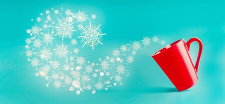 Red mug with flying snowflakes  at blue background. Winter and Christmas concept. Creative layout...