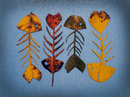 autumn leaves in the form of a swimming flock of fish