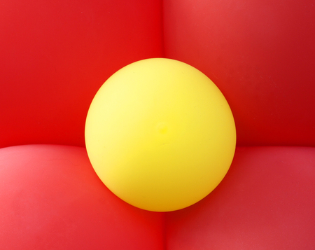 background of four red and yellow balloons
