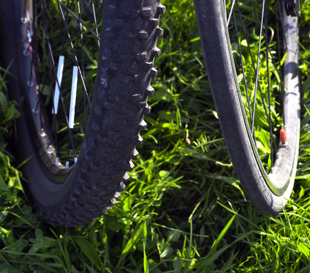 two wheels with a bicycle thin and thickの写真素材