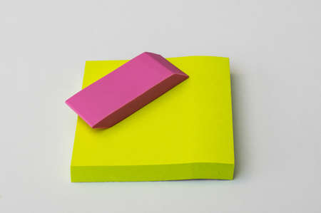 eraser and paper sticker colorful white yelow school table