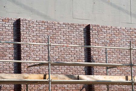 covering wall with bricks construction fasade decor