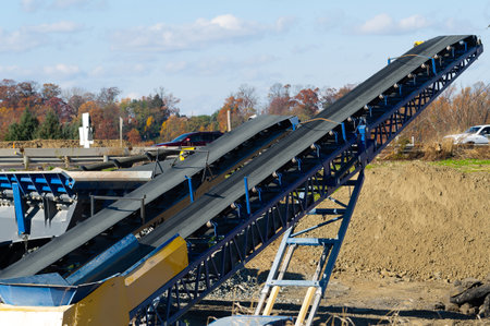 Mobile stone crusher machine by the construction site gravel mineral jobの写真素材