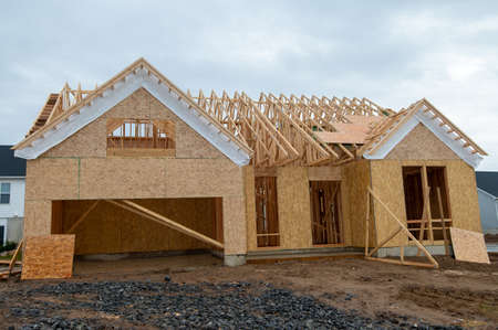 walls and rafters of a new plywood house frame