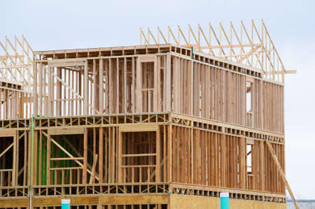 frame of a two story house new construction wooden work wall