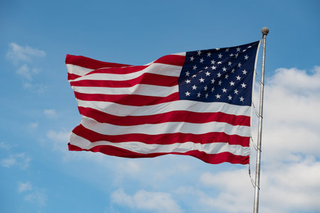 American flag waving in blue sky national glory patriotic