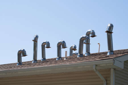 exhaust pipes on the roof aluminum metal industrial system modernの写真素材
