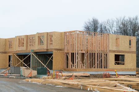 New house construction, framed, walls window plank plywood