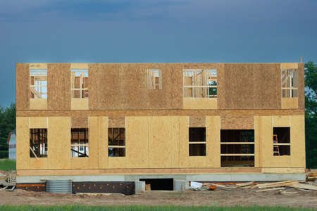 New apartment building under construction on sunny day on blue sky background modern development