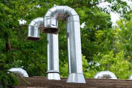 exhaust pipes on the roof industry metal heat system modernの写真素材