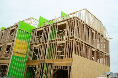 Large apartments is found under construction in the city frame plywood new homeの写真素材