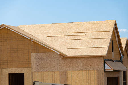 roof and walls of a plywood house frame unfinished build plank truss material