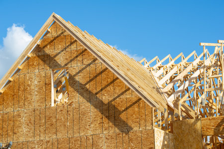 rafters and walls of new plywood house wooden framework building truss