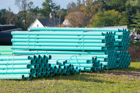 Polyethylene pipes HDPE water, lying on the pavement lie on the ground pipeline drain stockの写真素材
