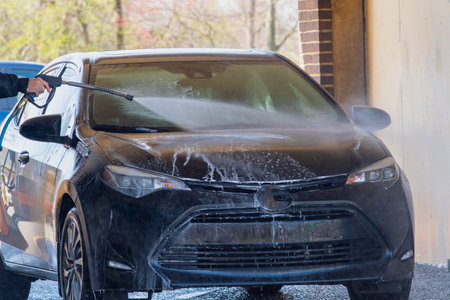 car washing cleaning with foam and high pressured water soap service jet manualの写真素材