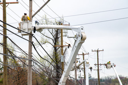 electrician worker work on fixing and changing by being in crane electricians on a crane line power...
