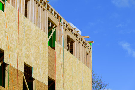 apartment building under construction on sunny day on blue sky background new condo