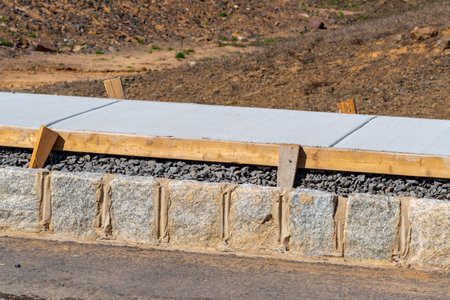 freshly pavenew concrete footpath sidewalk cement street material gray gravel urban walkwayd footpath job groundの写真素材