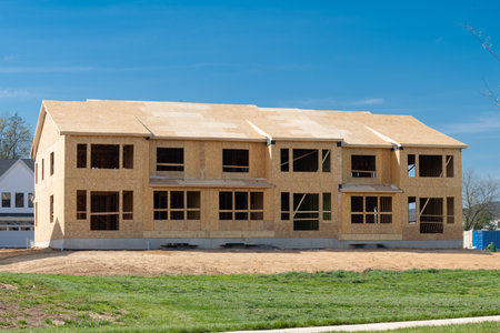 new condominium or apartment construction wood plywood house framework roof complex