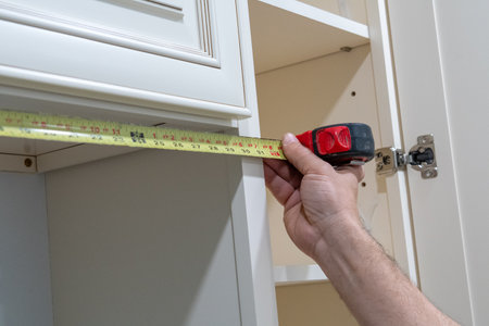 home improvement and interior design concepts kitchen handyman measureworker cabinetの写真素材