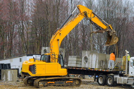 excavator at construction site heavy yellow big ground hydraulicの写真素材