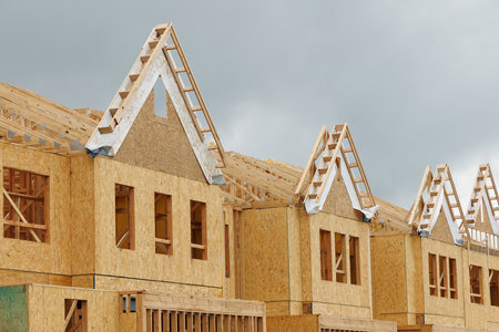 rafters and walls of a new plywood house building unfinished frame truss