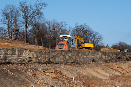 excavator and tractor working on a construction site shovel mover gravel