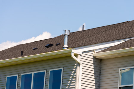 ventilation pipe on the roof of a new house metal chimney air smoke