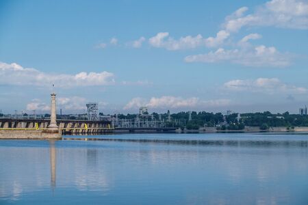 river pier. blue water. summer day at the river pier. clouds in the sky are reflected in the river.の写真素材
