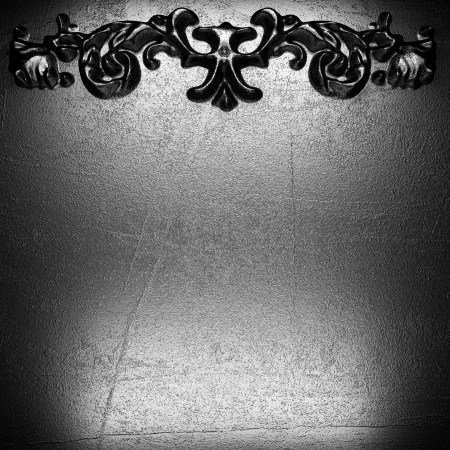 iron vintage ornament on wallの写真素材