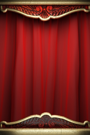gold on red velvet curtainの写真素材