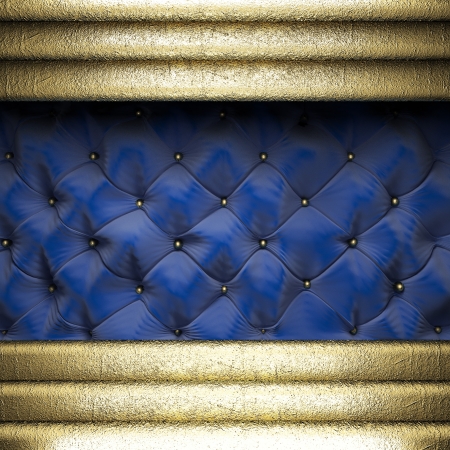 gold on blue fabric backgroundの写真素材