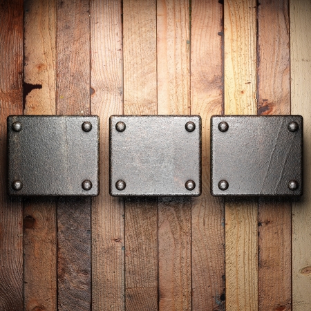 metal on wood backgroundの写真素材