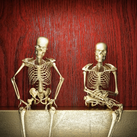 Golden skeleton on woodの写真素材