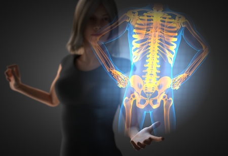 woman and hologram with bones radiographyの写真素材