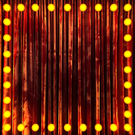 red velvet curtain stage with neon lightsの写真素材