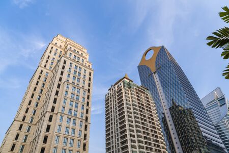Wide angle shot of skyscrapers in downtown, diminishing perspective. Bangkok city, the concept of corporate success.の写真素材
