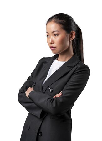 Confident asian woman in black suit, isolated on white.の写真素材
