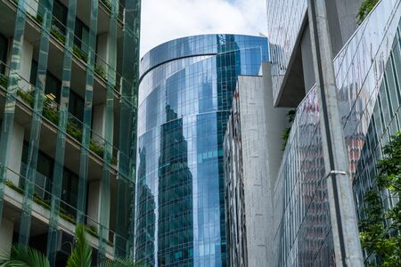 Low-angle view of picturesque skyscrapers of Singapore city downtown at day time. Financial district...