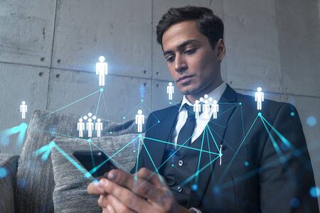 Man in office working with Smartphone, Searching for new people connections. Social media hologram,...