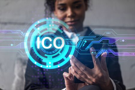 Businesswoman typing phone, work in modern office on new project. ICO blockchain hologram. Double exposure. Concept of success.の写真素材