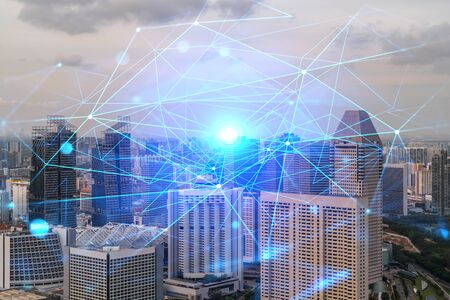 Hologram of abstract technology glowing icons, panoramic cityscape of Singapore at sunset, Asia. The...
