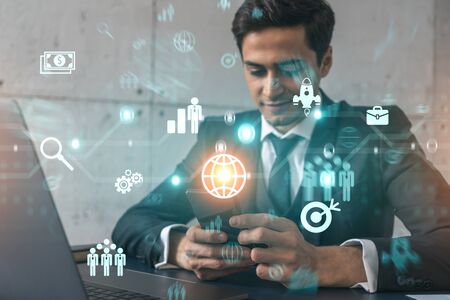 Analyst in office working with Smartphone, Searching for new technologies to boost business. Typing phone. Double exposure.の写真素材