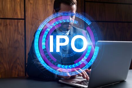 Businessman in office working with laptop technology online ipo, typing computer assemble data drawing invest concept. Double exposure.の写真素材