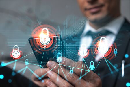 Man in office working with Smartphone, Searching for new technology to protect business information....