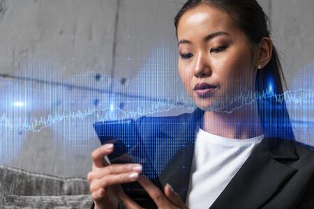 Businesswoman typing phone, work in modern office on new project. forex graph hologram. Double...