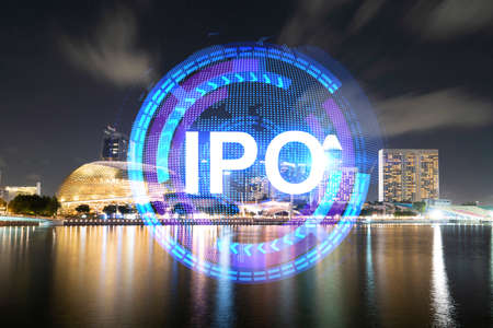 Initial public offering hologram, night panoramic city view of Singapore. The financial center for multinational corporations in Asia. The concept of boosting the growth by IPO process.の写真素材