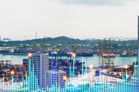 Financial stock chart hologram over panorama city view of Singapore, business center in Asia. The...